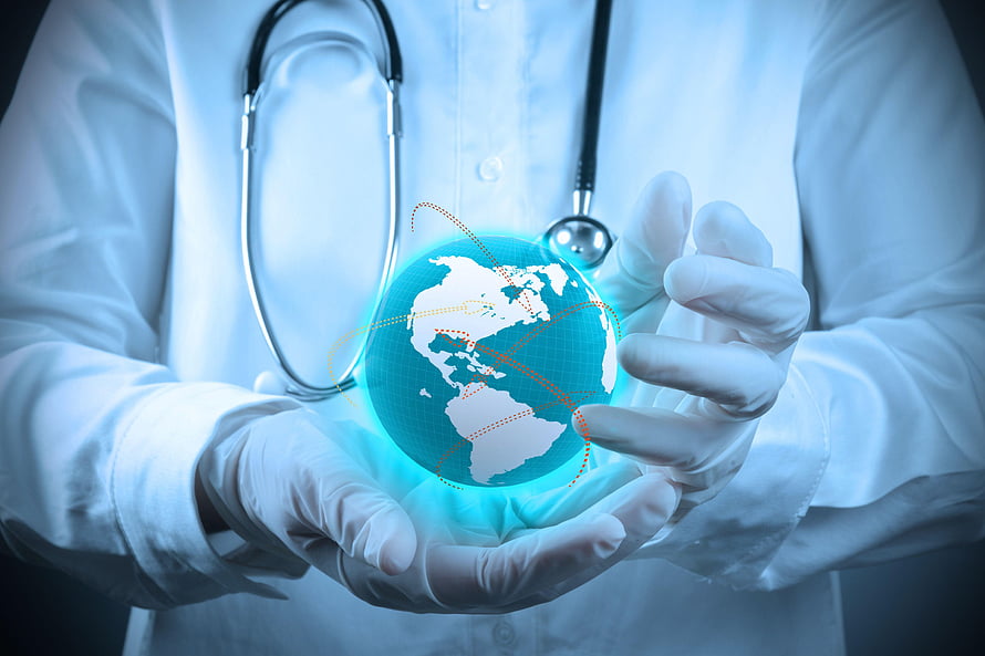 Doctor in white coat and gloves holding a glowing holographic globe with stethoscope HD wallpaper