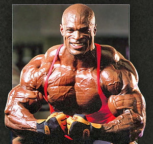 Ronnie Coleman Bodybuilding Pose in Red Singlet with Gloves HD wallpaper