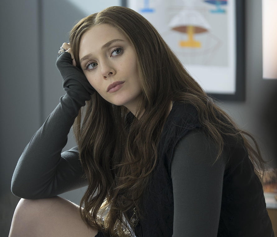 Elizabeth Olsen Pensive Portrait in Dark Casual Attire HD wallpaper