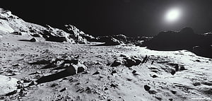 Black and White Lunar Surface Landscape with Rocky Terrain and Distant Sun HD wallpaper