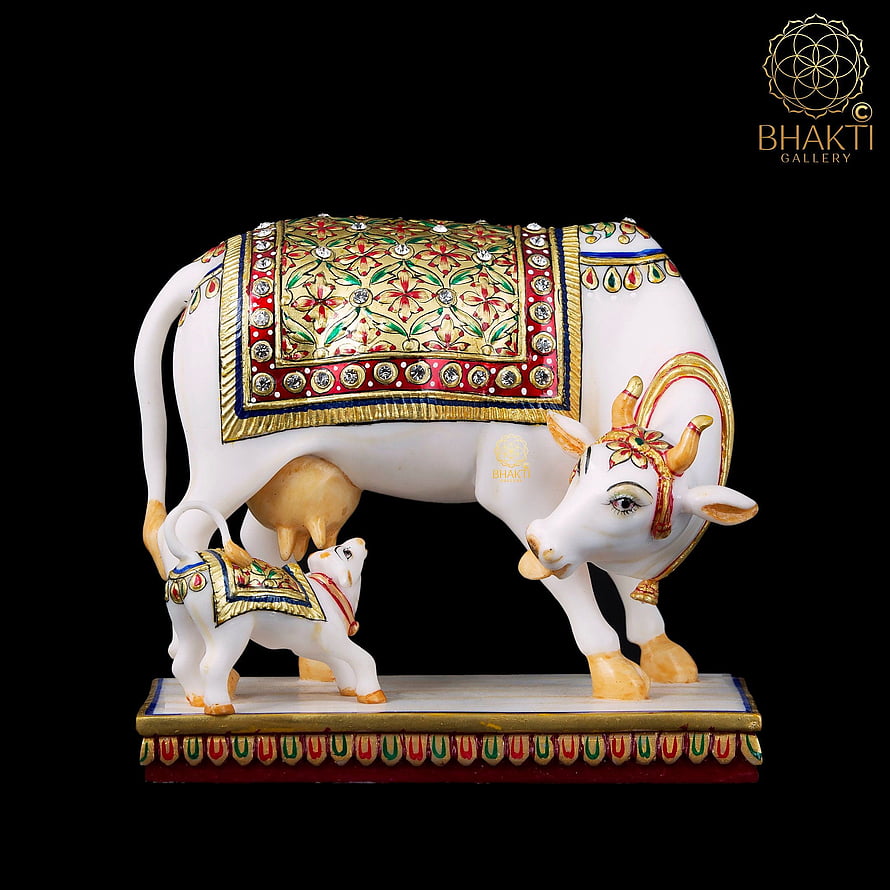 Kamadhenu Cow and Calf Decorative Statue with Ornate Floral Patterns and Gold Accents HD phone wallpaper