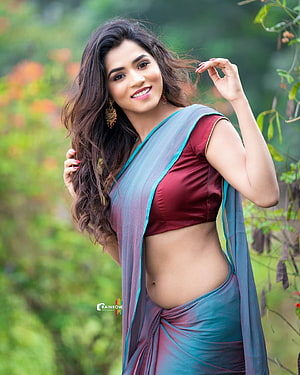 Viranika Shetty in a Maroon Blouse and Blue Saree Amidst Lush Greenery HD phone wallpaper