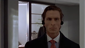 Patrick Bateman in a dark suit and red tie wearing a black headset in a modern office, Patrick Bateman in Heads, #patrick bateman HD wallpaper