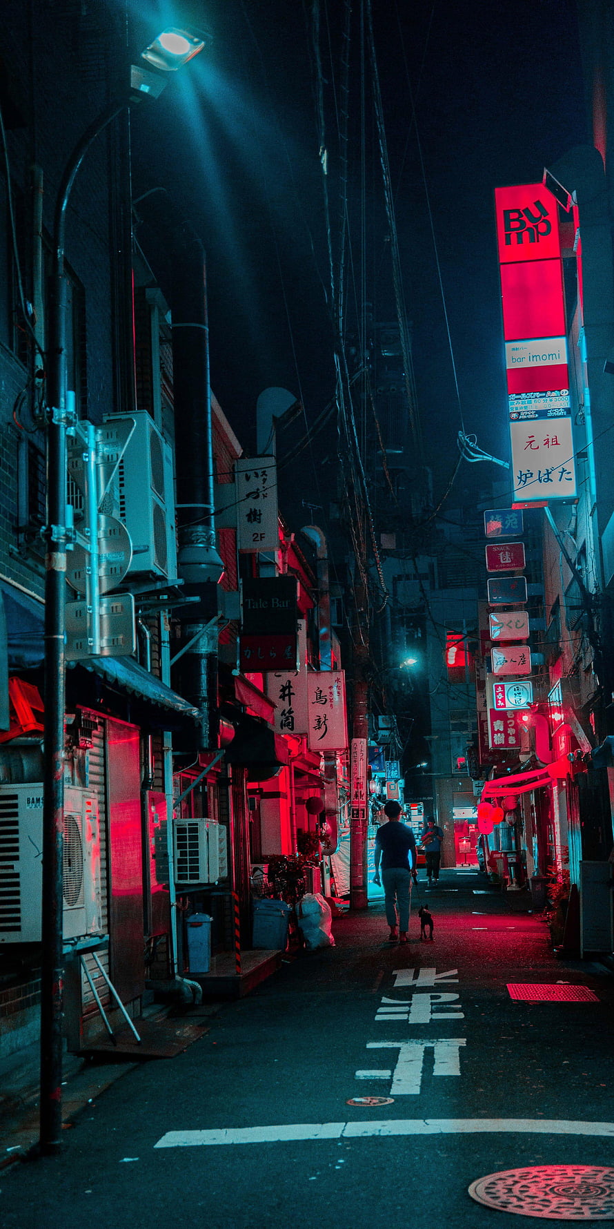 Neon-lit Japanese alley at night with a lone figure and dog walking through a cyberpunk cityscape HD phone wallpaper