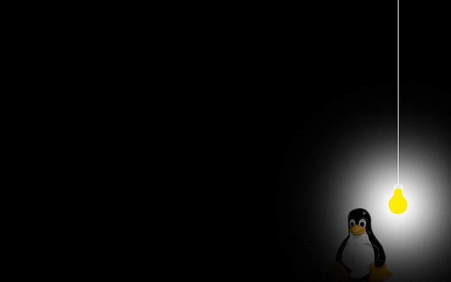 Tux the Linux Penguin Standing Under a Glowing Light Bulb in a Dark Minimalist Scene HD wallpaper