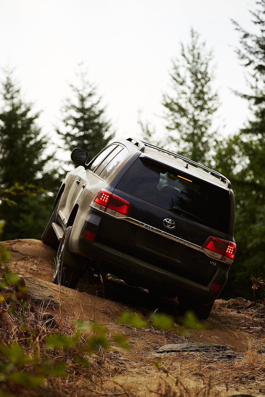 Black Toyota Land Cruiser V8 Off-Road on Rocky Forest Trail HD phone wallpaper