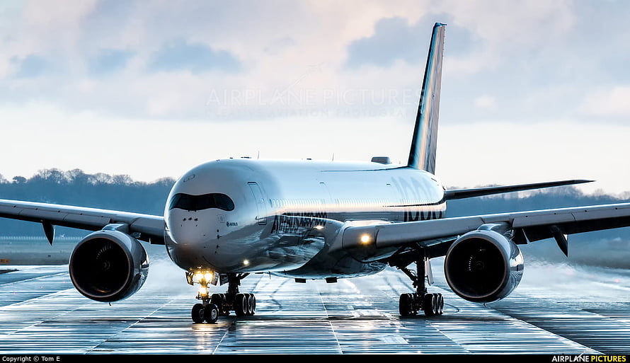 Airbus A350-1000 Wide-Body Jet Taxiing on Wet Runway at Dusk HD wallpaper