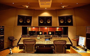 Professional Recording Studio Control Room with Large Mixing Console and Studio Monitors HD wallpaper