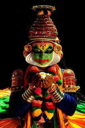 Kathakali Performer in Traditional Kerala Dance Costume with Elaborate Green Face Paint HD phone wallpaper
