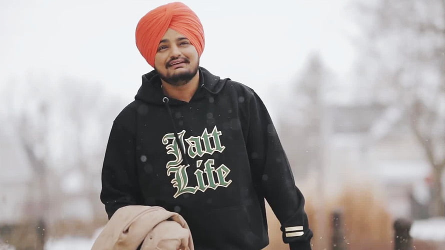 Sidhu Moose Wala in Orange Turban and Black Jatt Life Hoodie in Snowy Landscape HD wallpaper