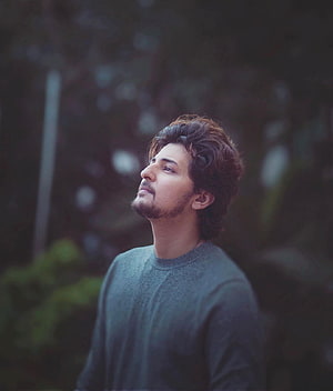 Darshan Raval in a contemplative outdoor portrait with soft natural lighting HD phone wallpaper