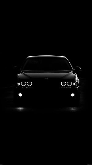 BMW M Power Front View in Dark Studio with Glowing Angel Eyes Headlights HD phone wallpaper