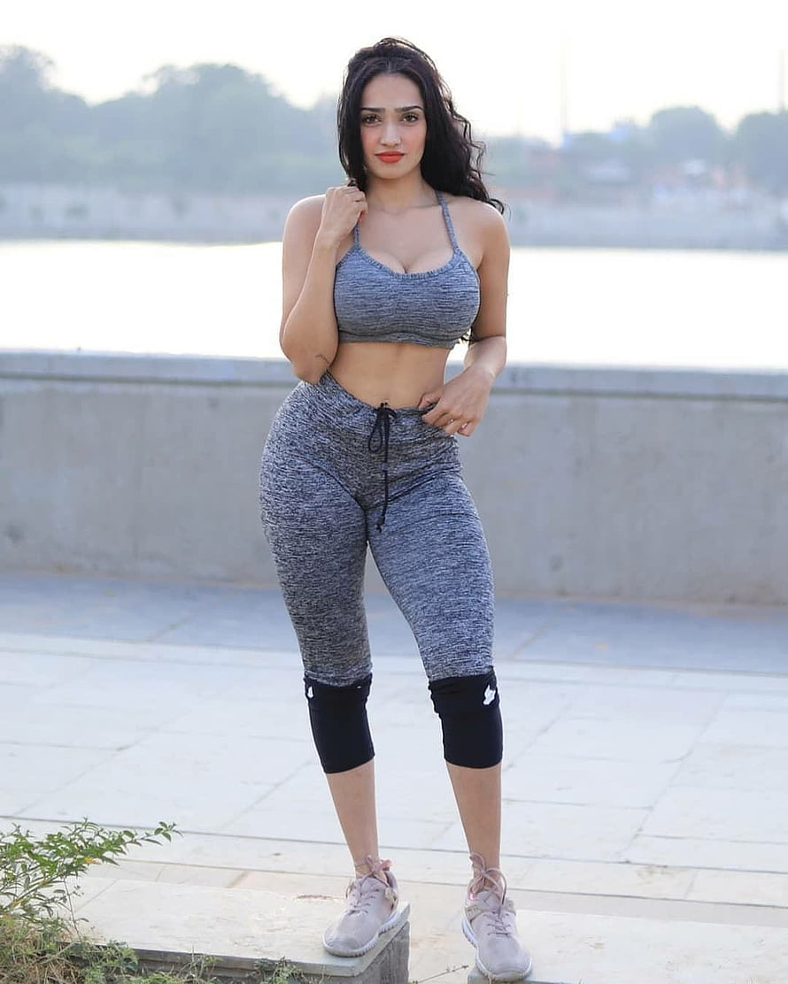 Aditi Mistry in Grey Heathered Activewear Set and Knee Sleeves by a Waterfront HD phone wallpaper