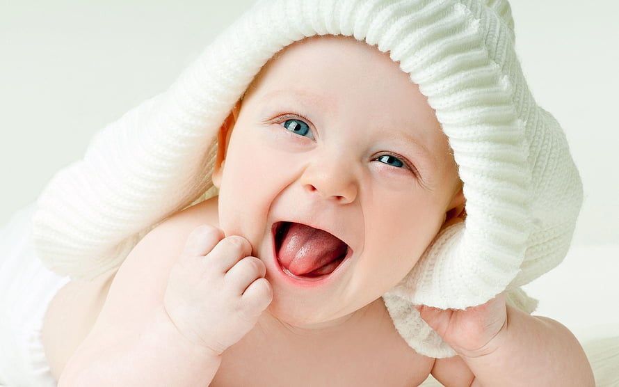Joyful Baby Boy Laughing With White Knit Hat And Blue Eyes HD wallpaper