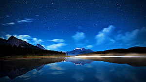 Starry Night Sky Over Mountain Lake With Perfect Reflections HD wallpaper
