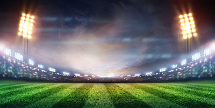 Illuminated Cricket Stadium at Night with Glowing Floodlights and Lush Green Pitch HD wallpaper