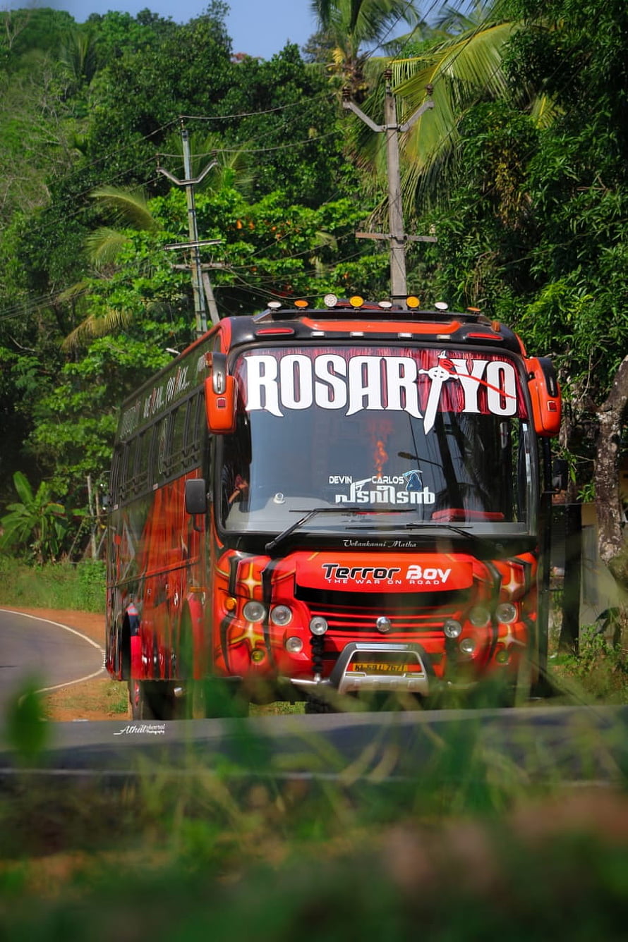 Rosariyo Travel Hub decorated bus on a tropical road in Kerala HD phone wallpaper
