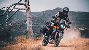 KTM 390 Adventure Rider Cornering on Dusty Off-Road Trail HD wallpaper