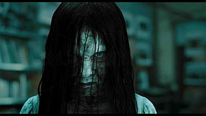 Terrifying Ghost Girl with Long Black Hair and Pale Face in Dark Horror Scene HD wallpaper