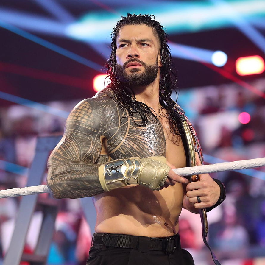 Roman Reigns in the WWE ring wearing gold gloves and holding a championship belt, A of our Tribal Chief, Roman Reigns.: WWE, roman reigns tribal chief HD phone wallpaper