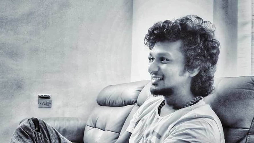 Lokesh Kanagaraj Portrait Sitting on Leather Sofa in Black and White HD wallpaper