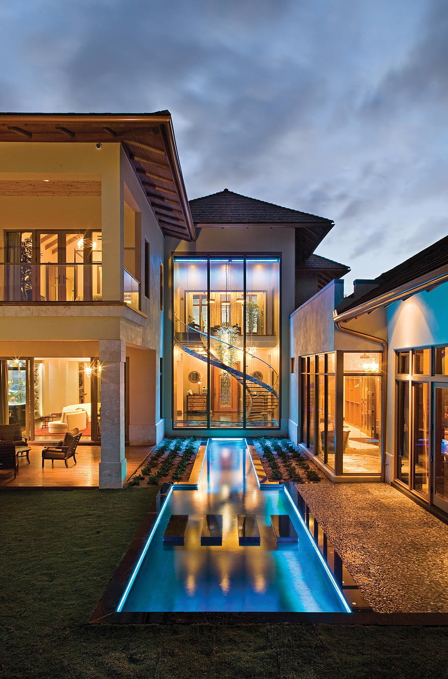 Modern Luxury Villa With Illuminated Spiral Staircase And Reflecting Pool At Dusk HD phone wallpaper