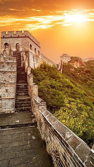 Great Wall of China at Golden Hour with Watchtowers and Mountainous Terrain HD phone wallpaper