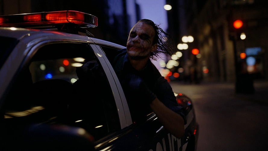 The Joker in a police car at night from The Dark Knight HD wallpaper