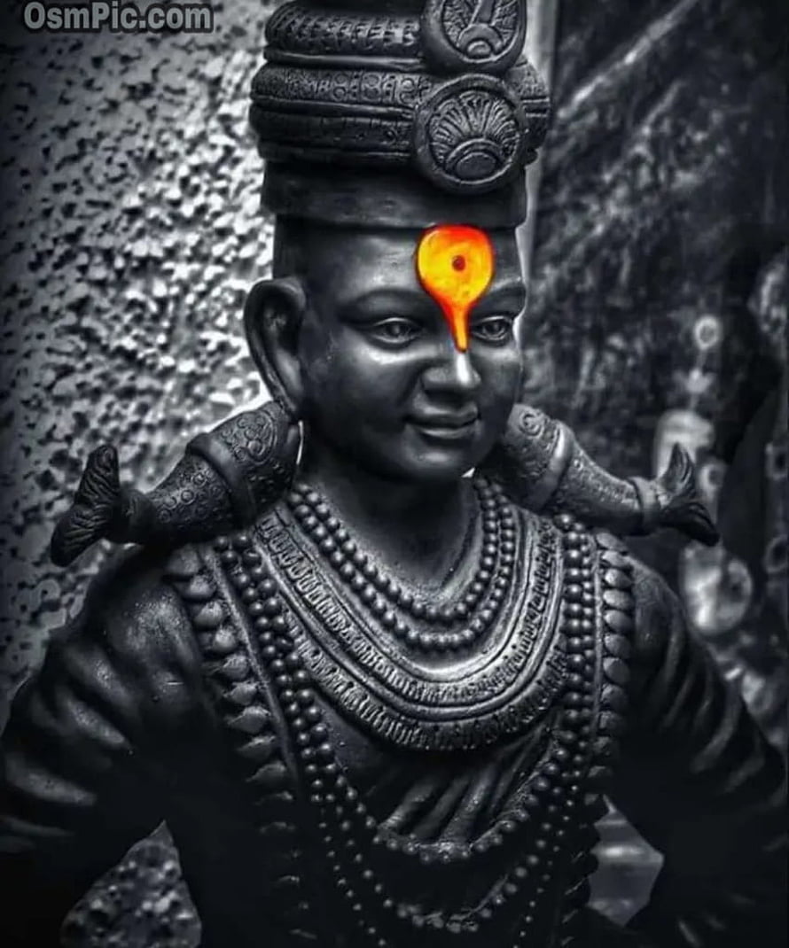 Black and White Statue of Vitthal with Glowing Orange Tilak and Traditional Ornamentation HD phone wallpaper