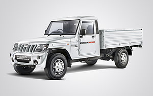 White Mahindra Bolero Pickup Truck Studio Shot on Neutral Background HD wallpaper