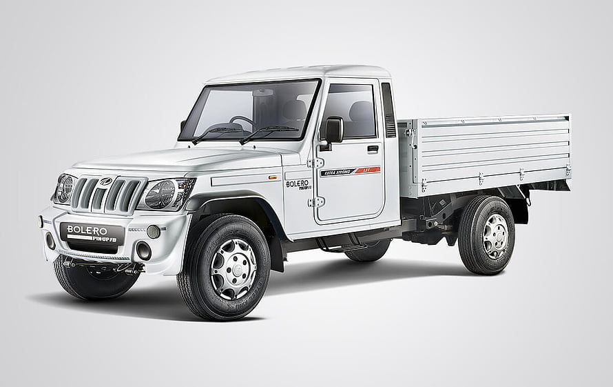 White Mahindra Bolero Pickup Truck Studio Shot on Neutral Background HD wallpaper