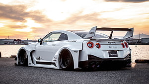 White Nissan GT-R R35 with Liberty Walk Widebody Kit and Large Rear Wing at Sunset HD wallpaper