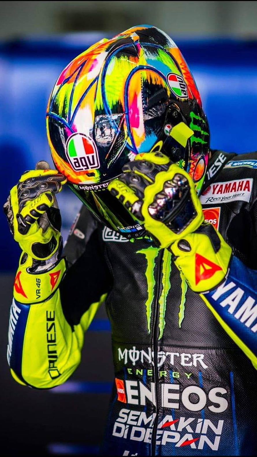 Valentino Rossi in Vibrant Monster Energy Yamaha Racing Suit and AGV Helmet HD phone wallpaper