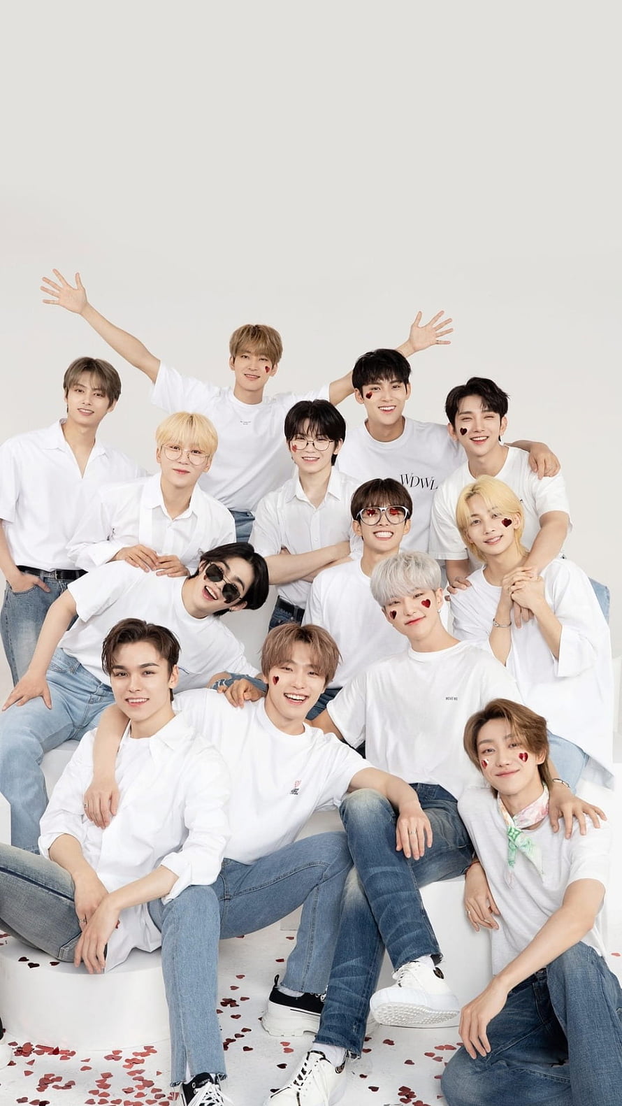 Seventeen Group Portrait in White Shirts and Jeans with Heart Face Paint HD phone wallpaper