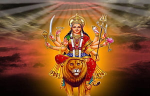 Maa Durga Riding a Lion with Multiple Arms Holding Sacred Weapons and Lotus HD wallpaper
