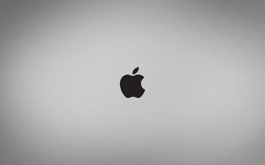 Minimalist Apple Logo on Textured Gray Background HD wallpaper
