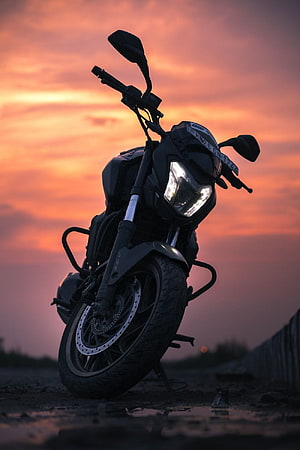 Bajaj Dominar 250 Motorcycle Silhouette Against Vibrant Sunset Sky HD phone wallpaper