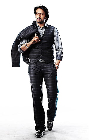 Kiccha Sudeep in a stylish dark plaid suit and vest with a confident pose HD phone wallpaper