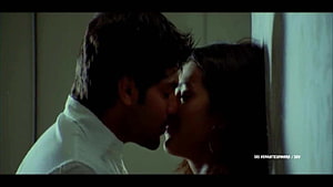 Simbu and Trisha in an intimate cinematic moment from a Tamil film HD wallpaper