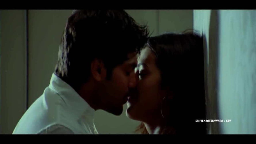 Simbu and Trisha in an intimate cinematic moment from a Tamil film HD wallpaper