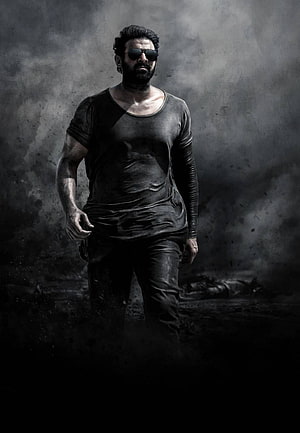 Prabhas as Salaar in a gritty monochrome action portrait with dark smoky atmosphere HD phone wallpaper