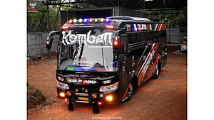 Komban Holidays Tourist Bus with Custom LED Lights and Black Red Livery HD wallpaper