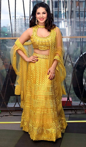 Sunny Leone in a Golden Embroidered Lehenga Choli with Sheer Dupatta HD phone wallpaper