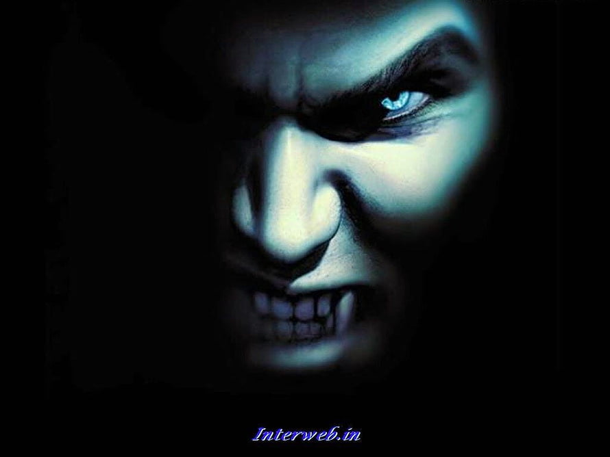 Menacing Vampire Face With Glowing Blue Eyes In Dark Shadowy Portrait HD wallpaper
