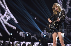 Taylor Swift performing with acoustic guitar on stage at the MTV Video Music Awards HD wallpaper