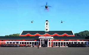 Indian Military Academy Dehradun with helicopter flyover and ceremonial guard HD wallpaper