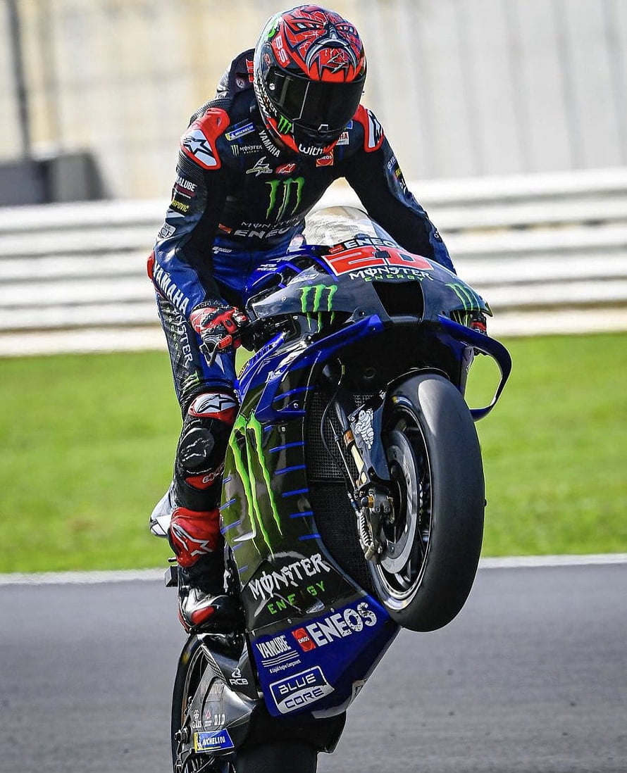 Fabio Quartararo on Yamaha YZR-M1 performing a wheelie at the 2021 MotoGP World Championship HD phone wallpaper