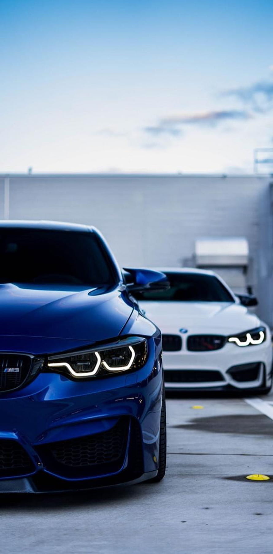 Blue BMW M4 CS and White M4 Parked Side by Side in a Concrete Garage HD phone wallpaper