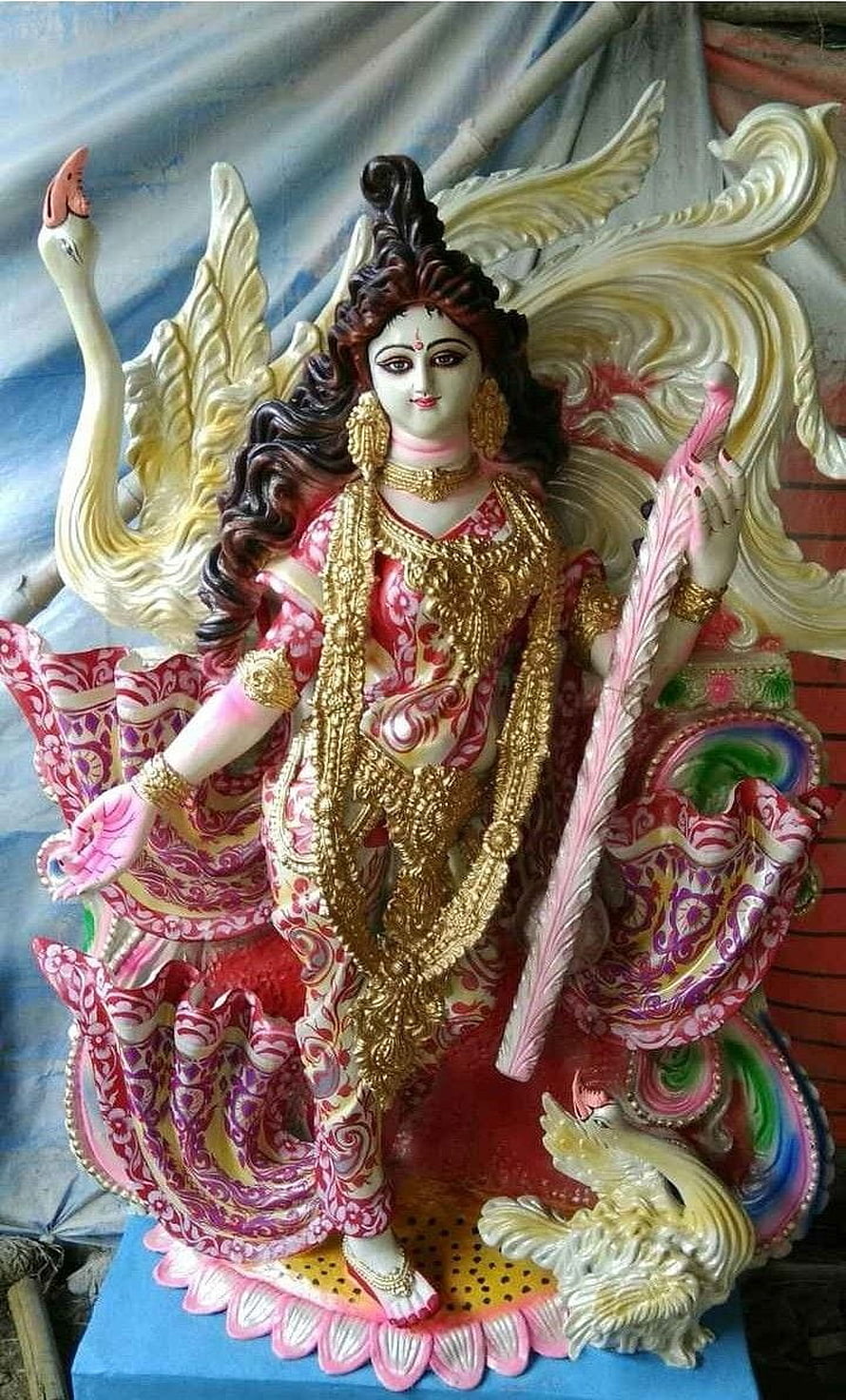 Saraswati Murti Statue with Swan and Ornate Gold Jewelry HD phone wallpaper