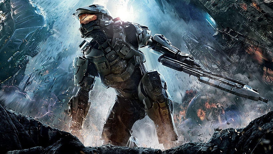 Master Chief in Heavy Armor Holding Rifle Amidst Battlefield Debris and Explosions HD wallpaper